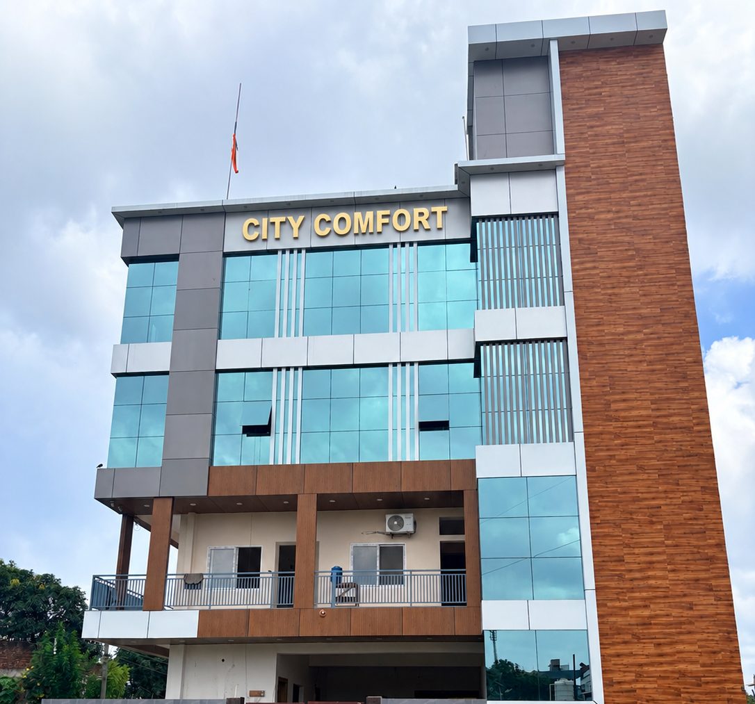 City Comfort Hotel from outside — a glass-fronted building with the City Comfort sign